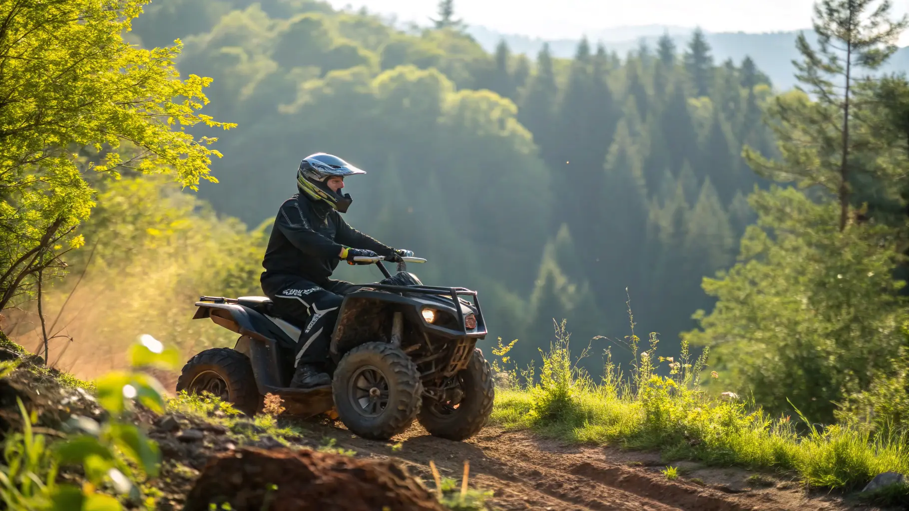 A rider wearing safety gear riding an off-road motorcycle through a forest.