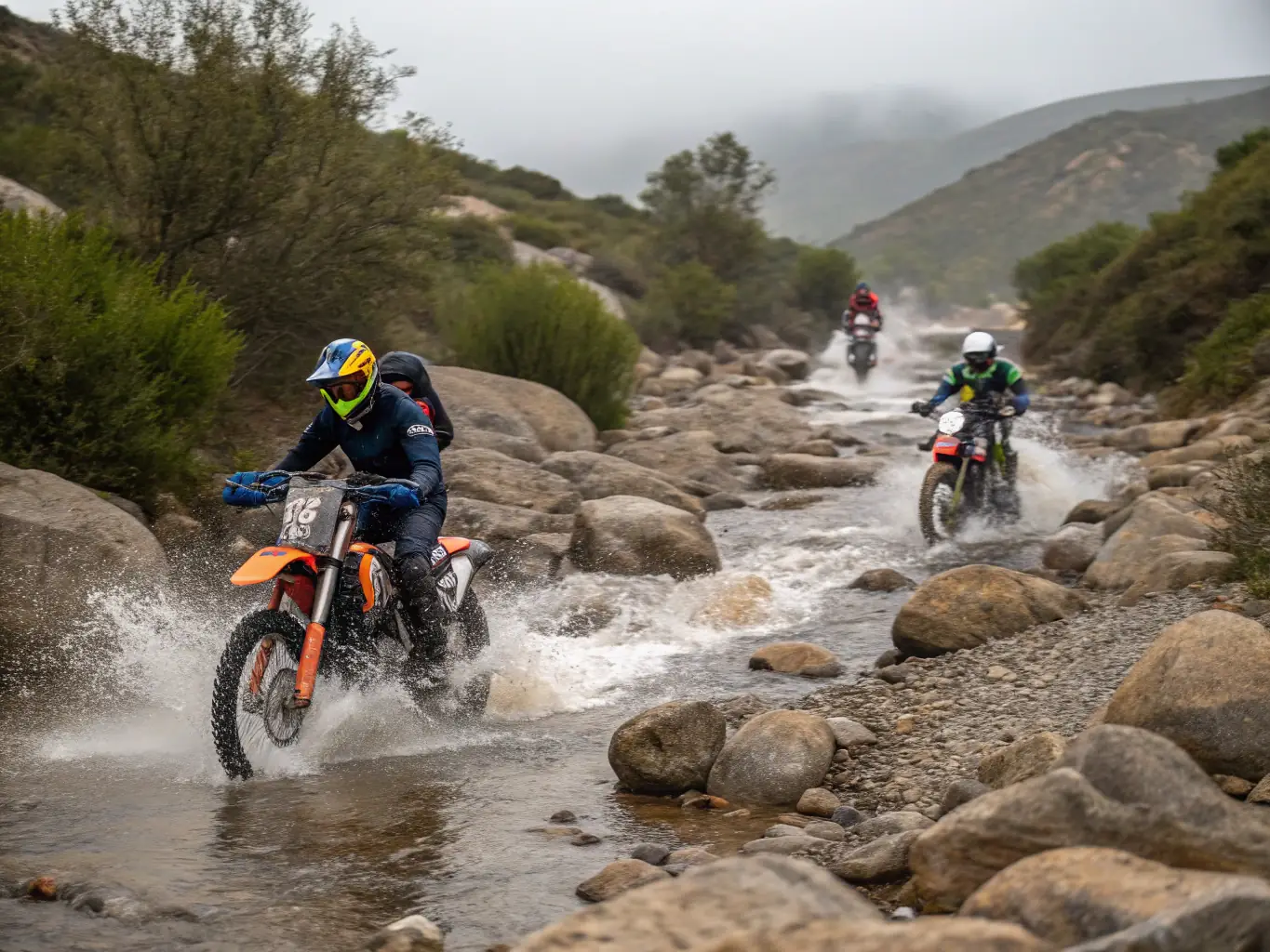 An image of experienced riders navigating a challenging off-road trail, showcasing advanced riding techniques and teamwork.